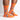 side view of model wearing rad chicken men's crew socks in orange